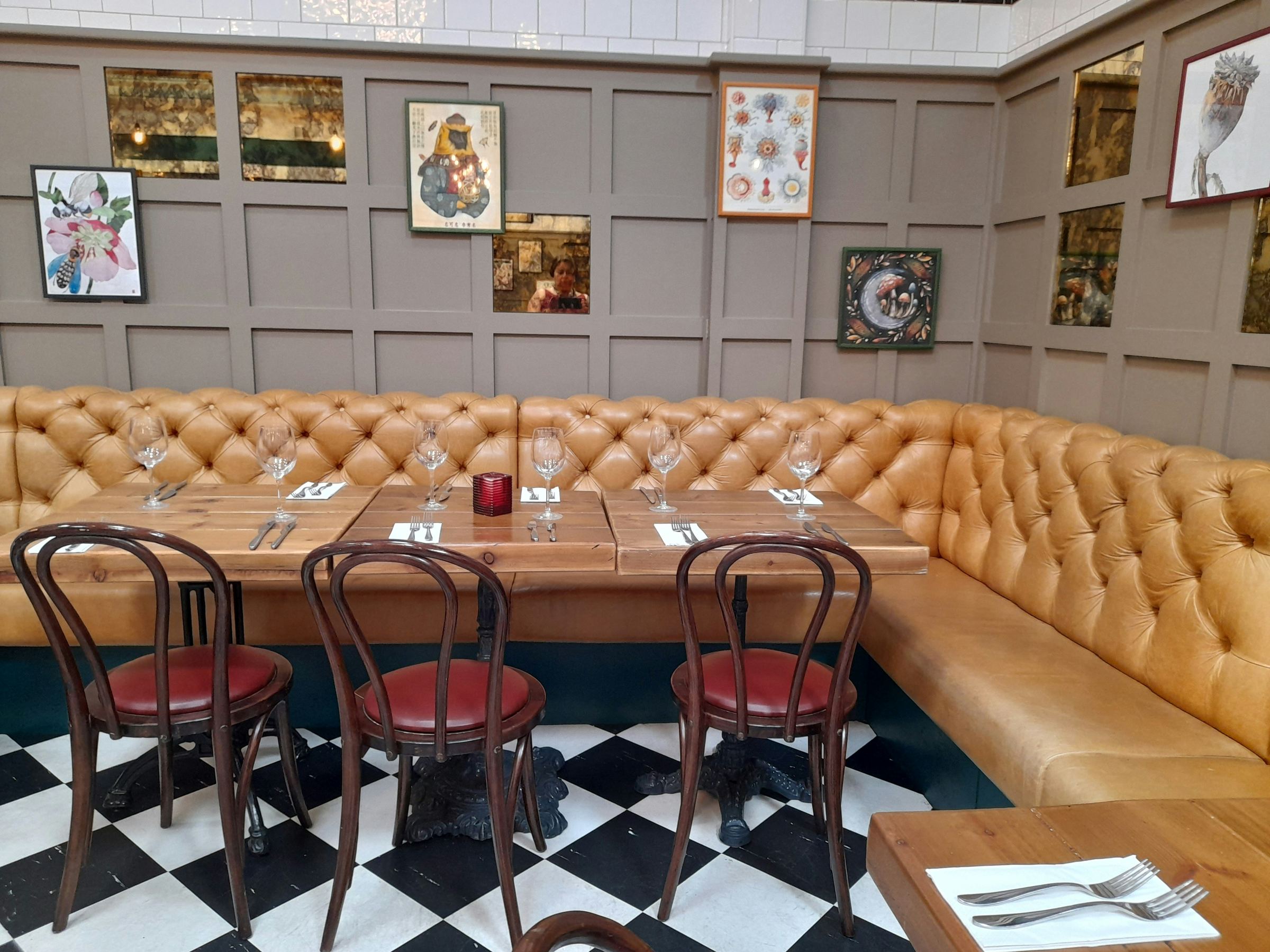 Classic bistro with tufted leather banquette and bentwood chairs