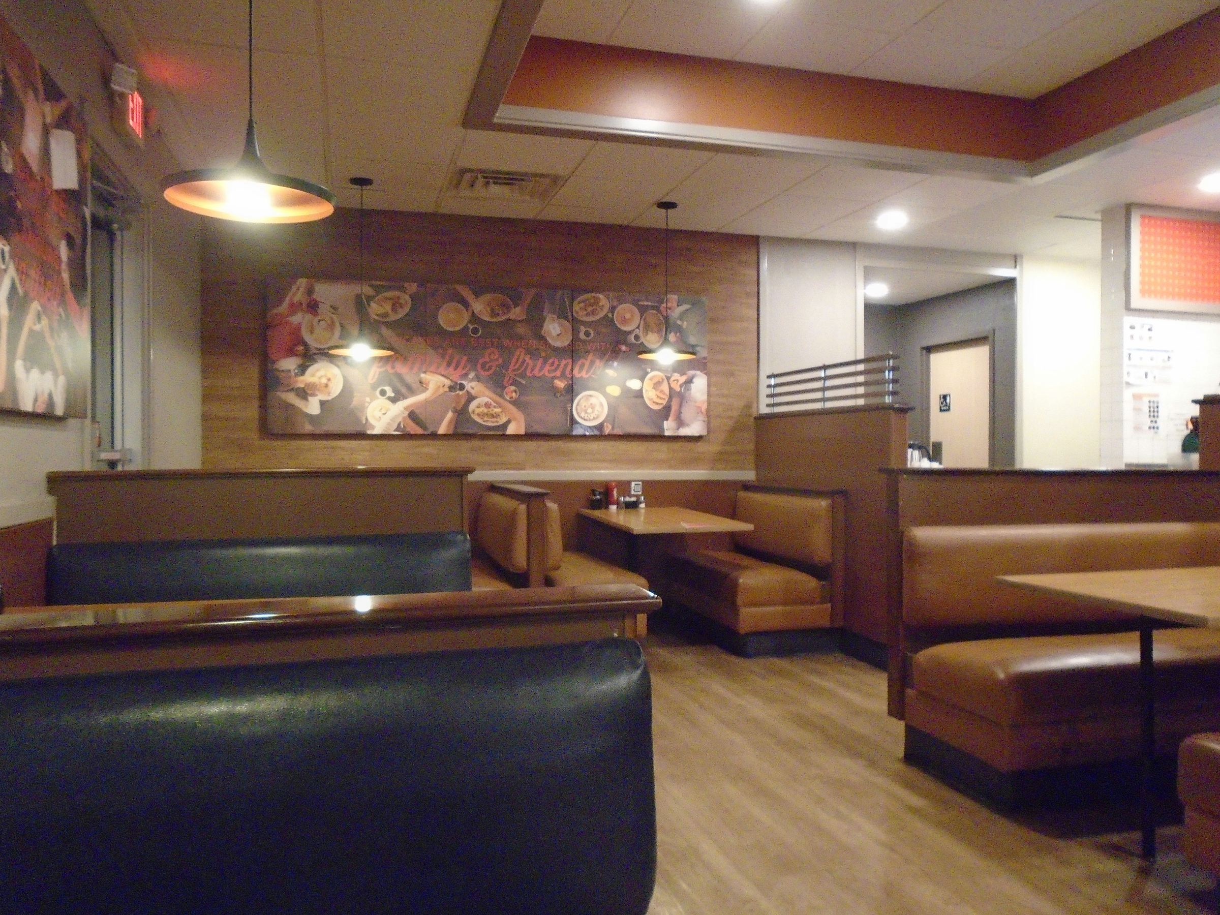 Casual restaurant dining room with booth seating